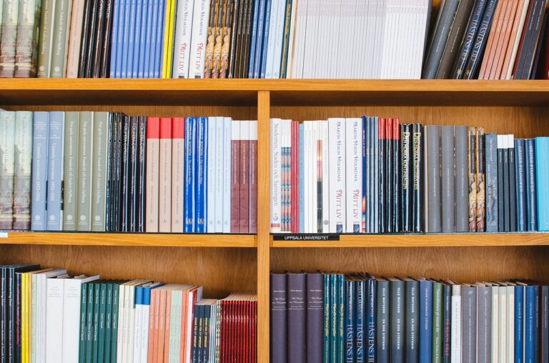 Photograph of a bookshelf with lots of organized books